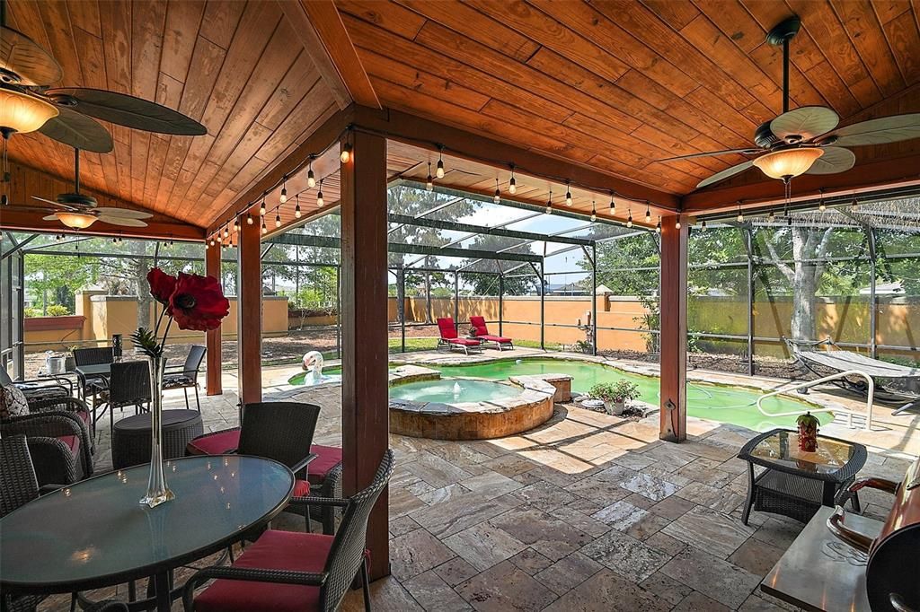 covered lanai with tongue and groove ceiling, ambient lgihting and the perfect cozy place to get out of the sun