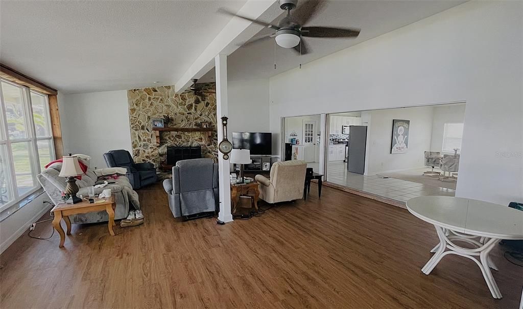 Expansive Family Room has a Wood Burning Fireplace