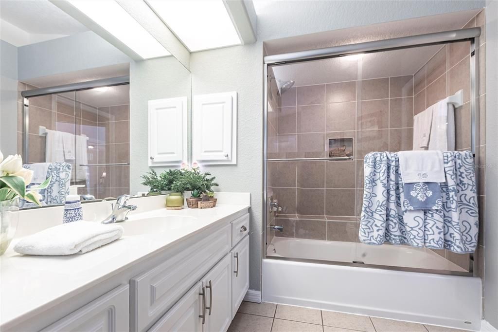 The main bath opens to the pool area.