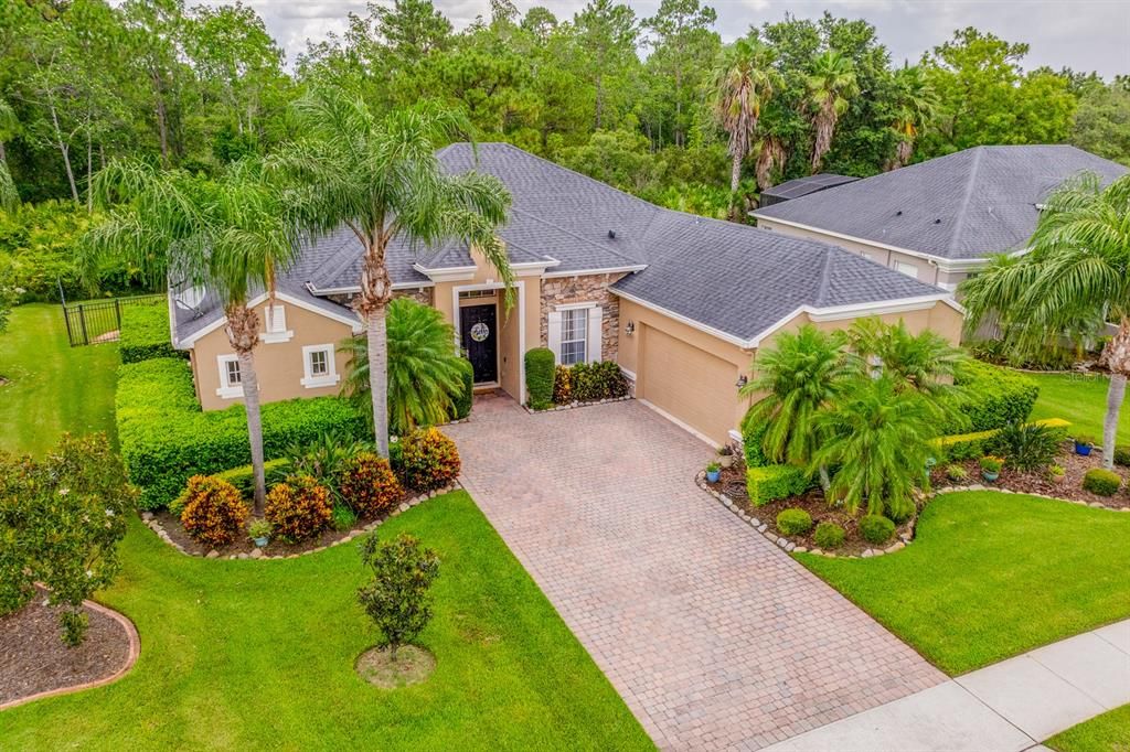 This spacious single story POOL HOME is perfectly situated on a large .24 ACRE ~ CONSERVATION LOT, offering peaceful wooded views and a superb layout that is ideal for both everyday living and entertaining!