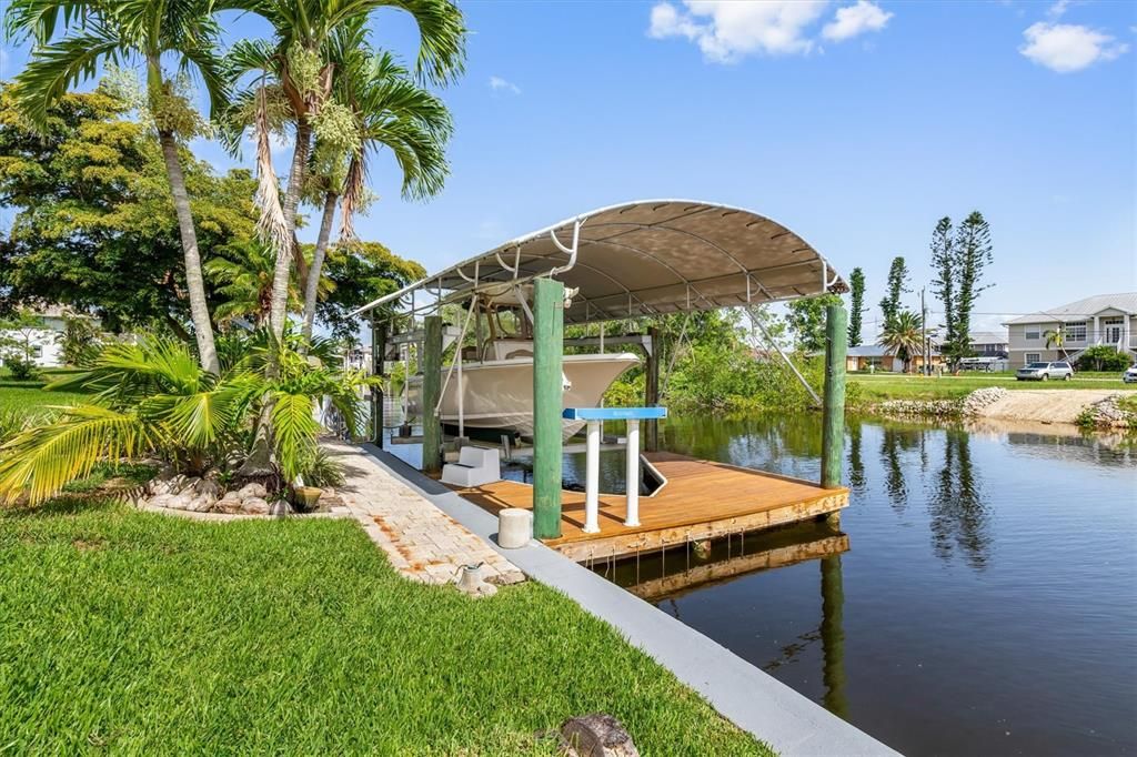 This community allows covered lifts.  Water & Electric at the dock