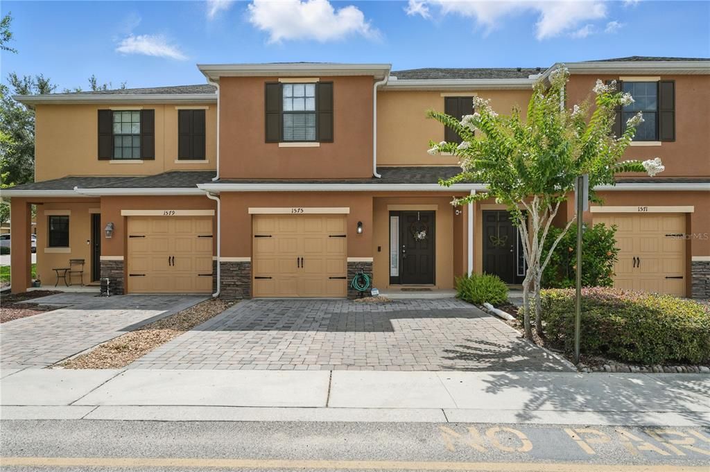 Extended paver driveway perfect for 2 cars parked side by side.