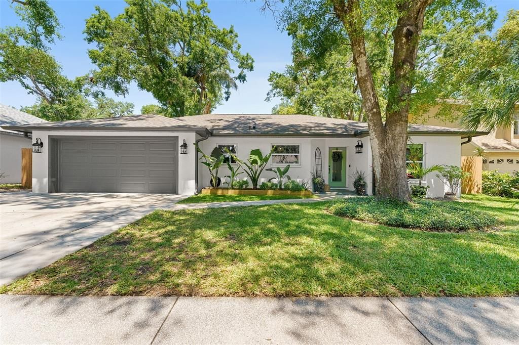 Front of house with two car garage.