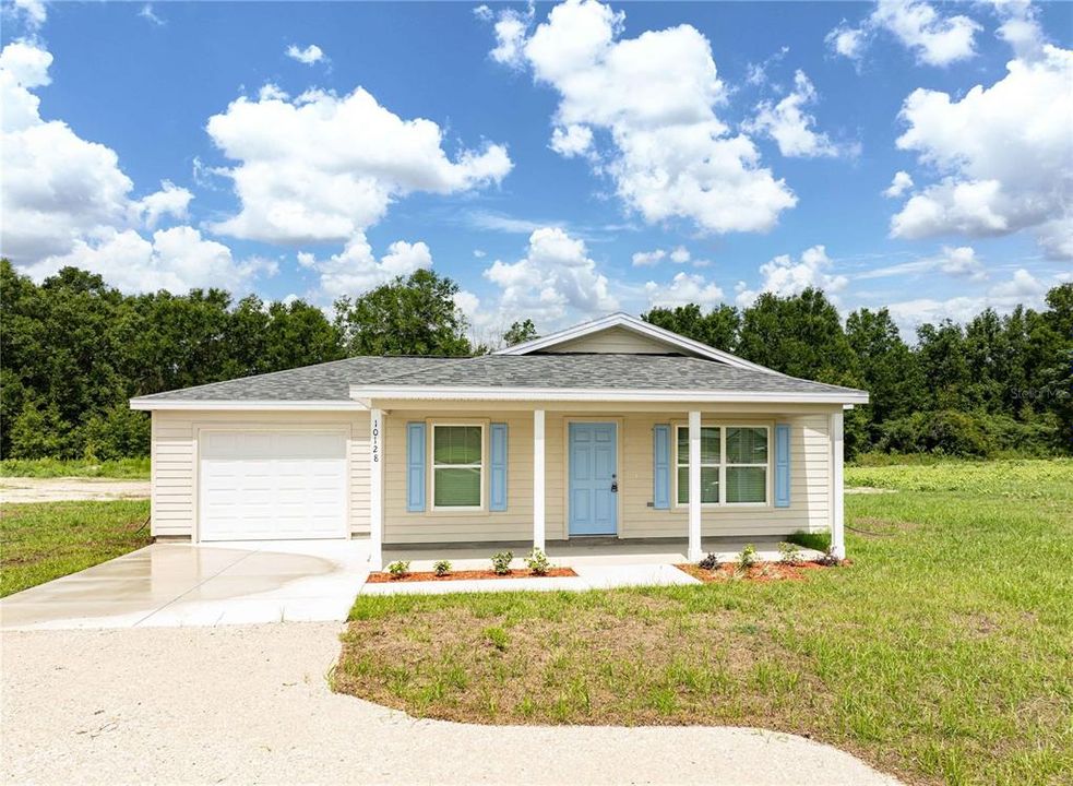 Inviting entrance to this brand-new home that combines modern style and everyday comfort