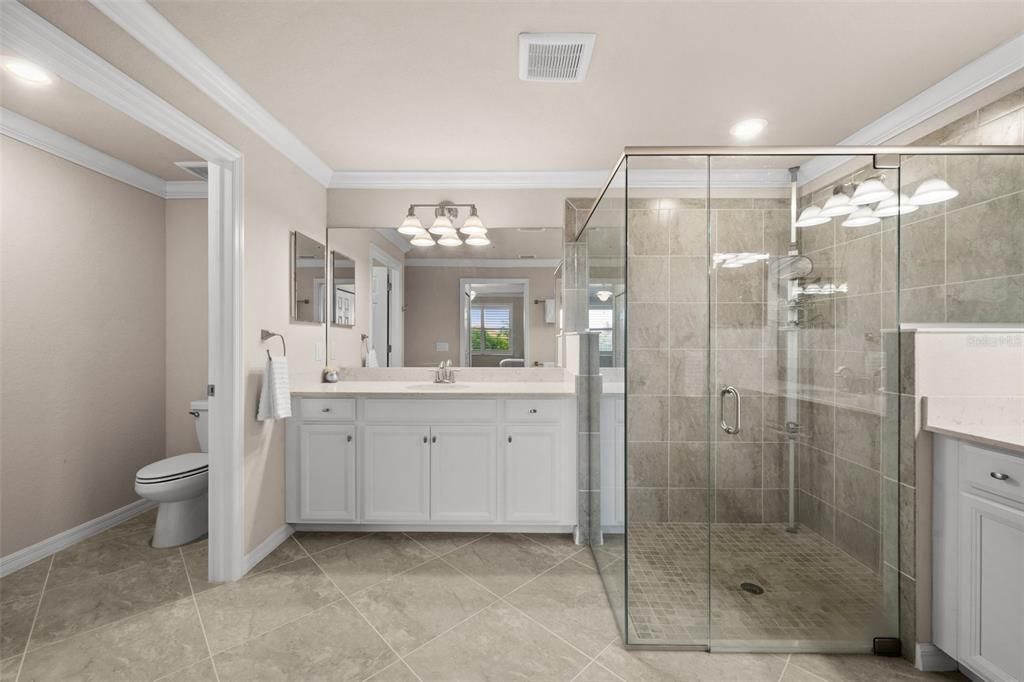 Master Bath with gorgeous tiled, glass-walled shower