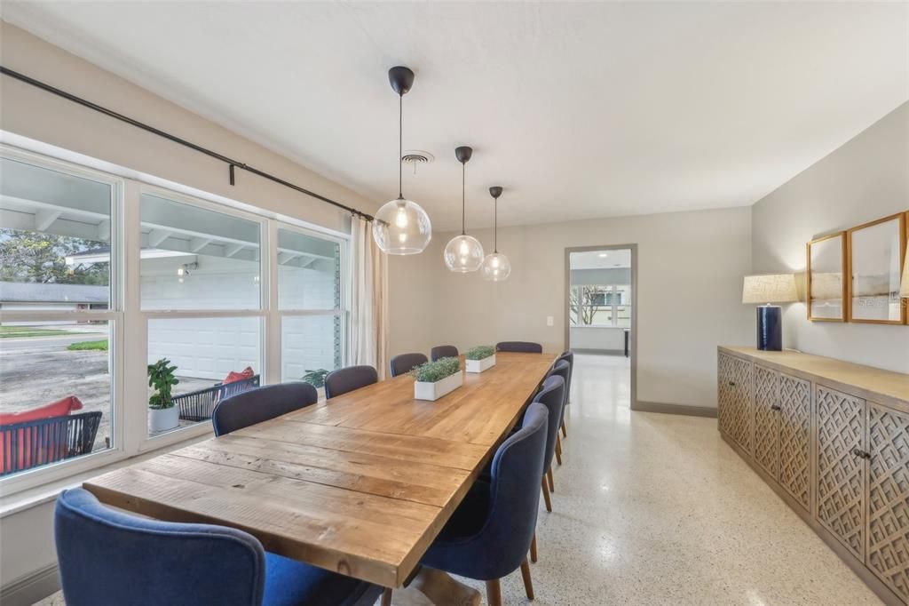 Dining room features large windows with a view of the front yard