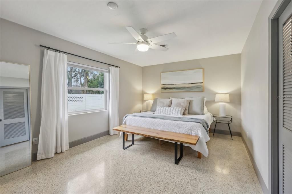 Primary bedroom with view of the backyard