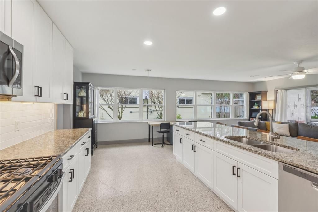 Kitchen opens to the family room and includes granite countertops