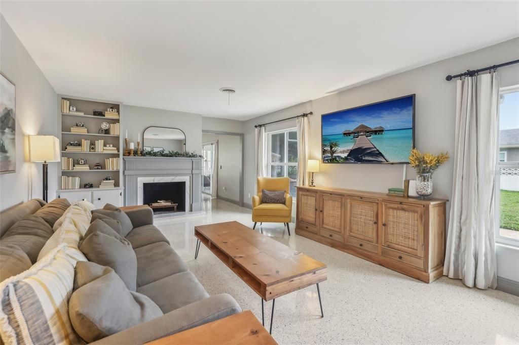 Living room with view of entrance leading into the family room