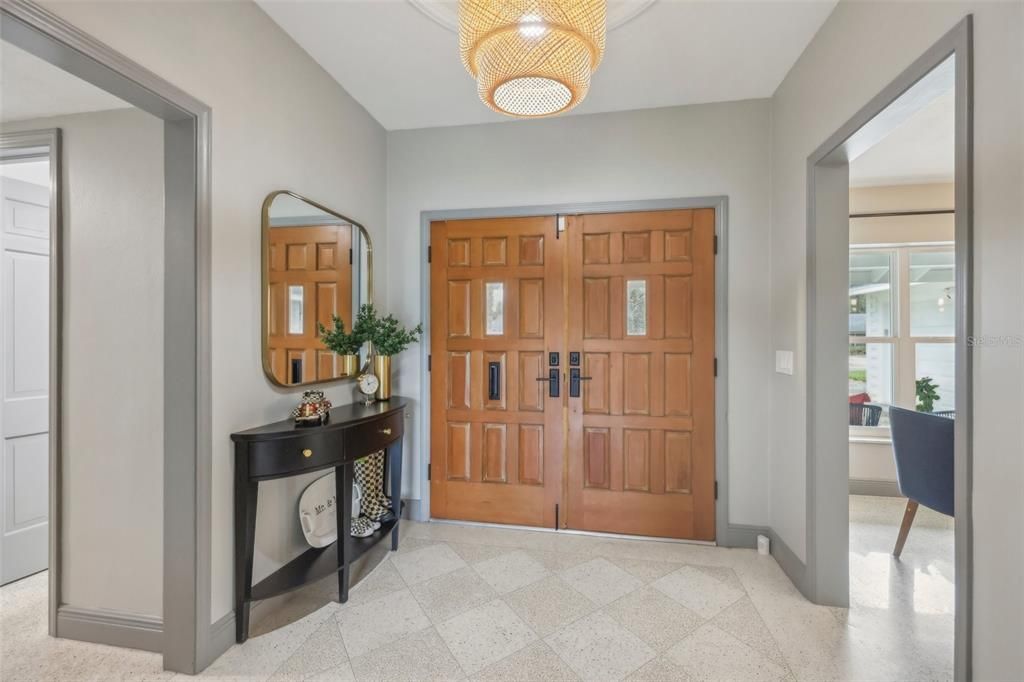 Spacious foyer with decorative terrazzo flooring