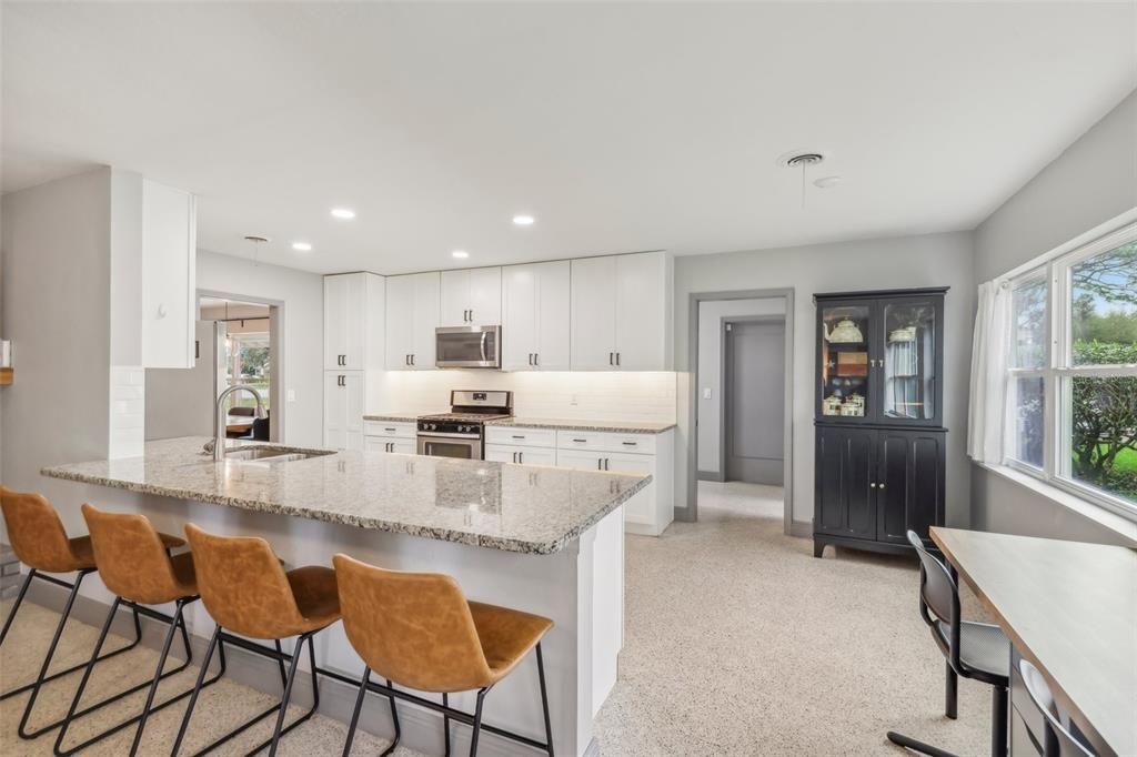Large breakfast bar in the kitchen is a great place for morning coffee