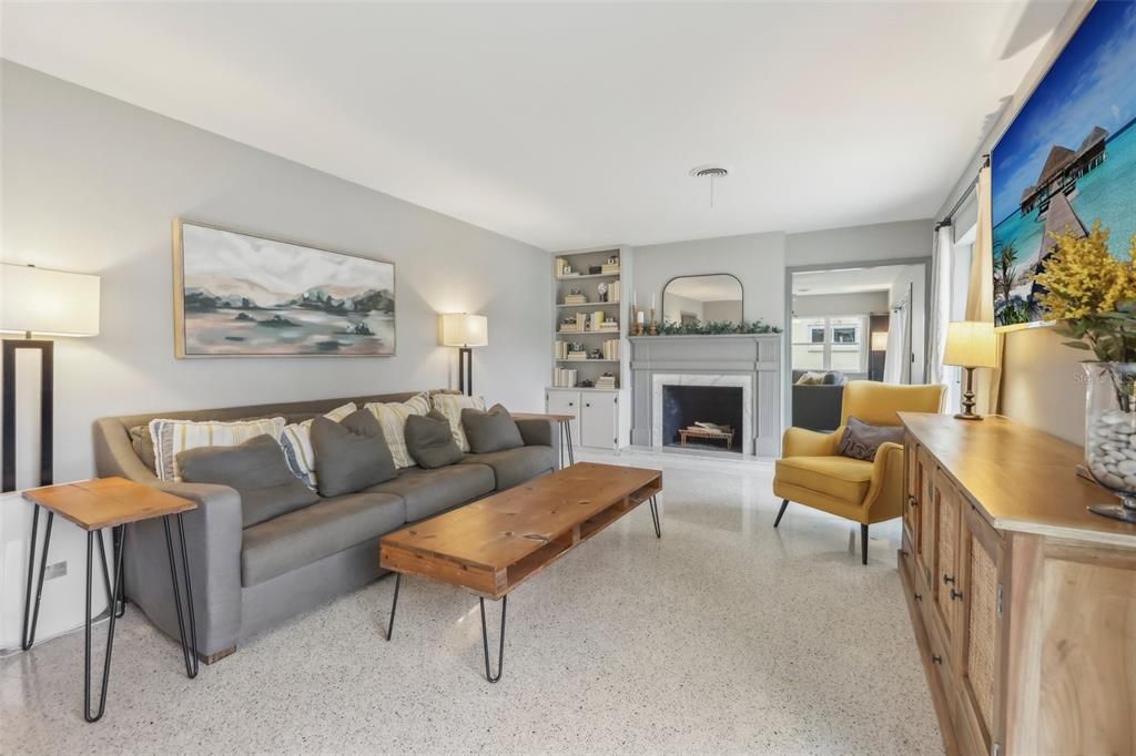 Living room includes a wood burning fireplace