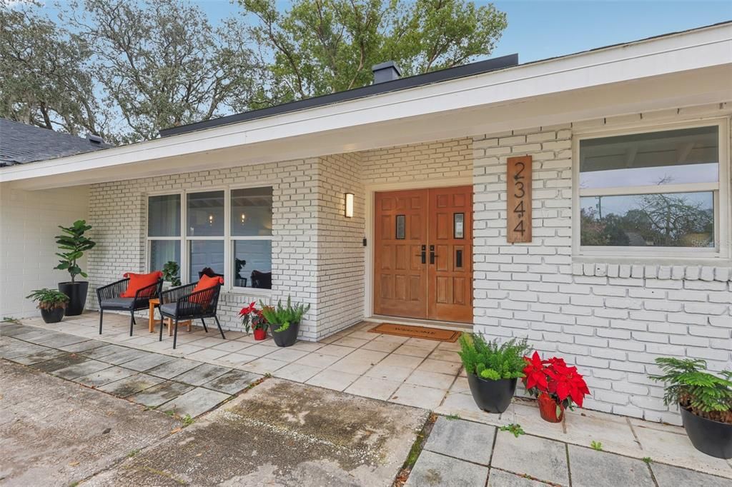Great your guests by way of the covered entrance and beautiful double doors