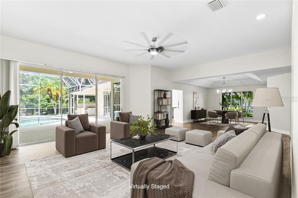 Large Living/Dining Room with sliders to the pool deck. (Virtually Staged)