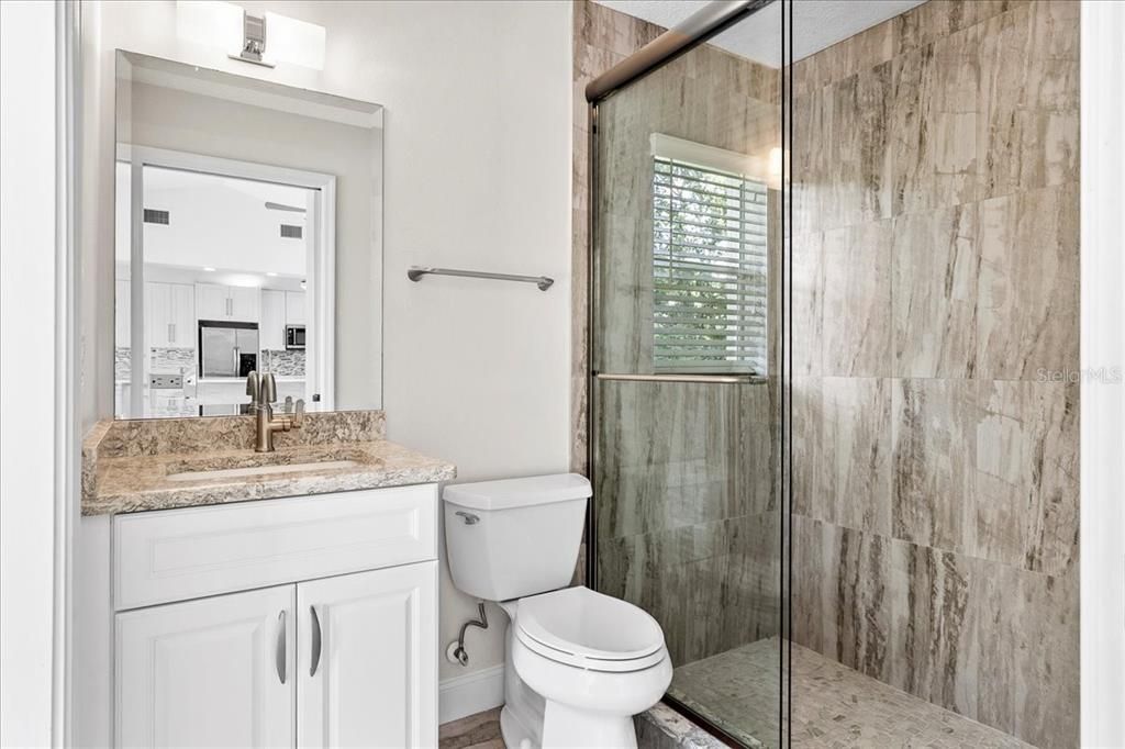 Full bathroom 3 is conveniently located off the family room and is accessible from the lanai and pool.