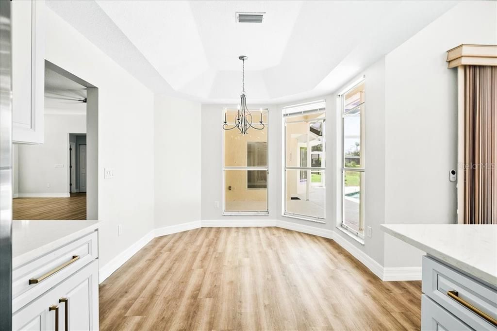 Kitchen dinette is perfect for everyday dining.  Enjoy the pool and lake views.