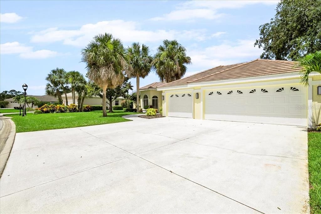 Large 3-car garage with plenty of driveway parking.