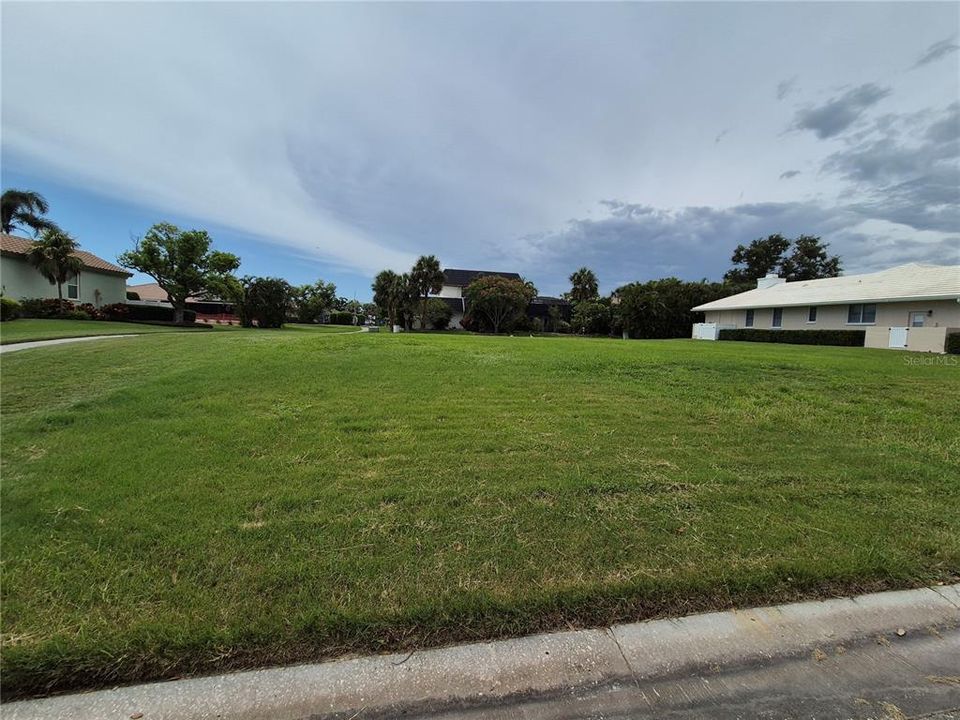 This lot awaits your dream home in Southbay Yacht and Racquet Club!