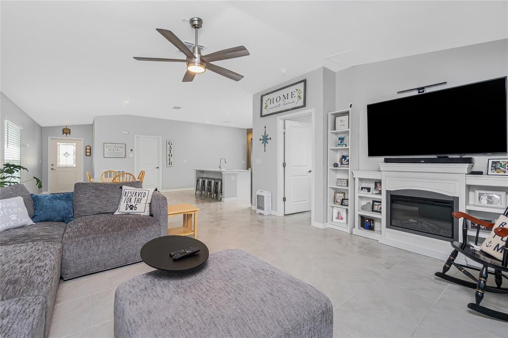 LIVING ROOM SELLERS ARE LEAVING FIREPLACE AND BOOK SHELVES