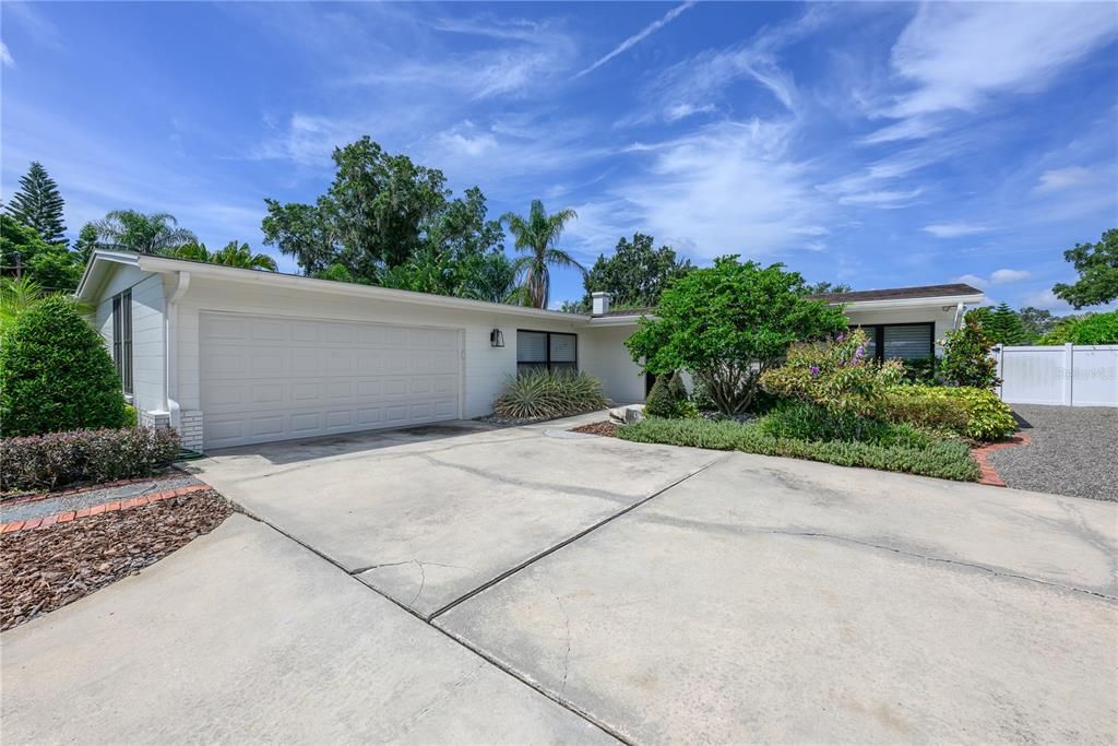Two car garage with new garage door. Huge driveway for parking.