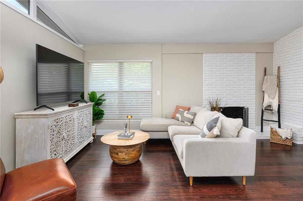 Living room with laminate wood flooring.