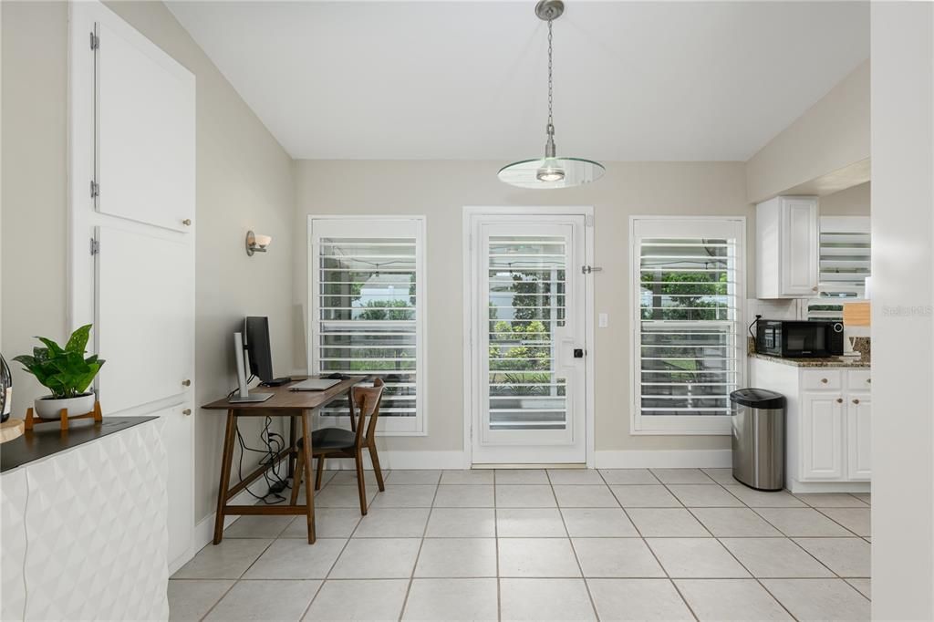Nook space with french door leading out to the patio.
