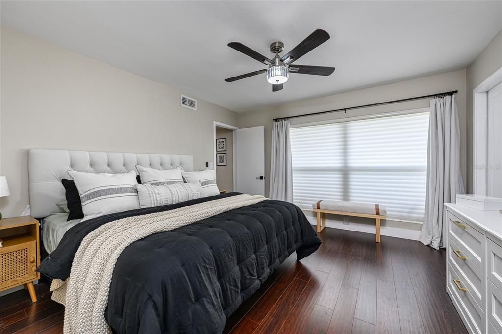 Primary bedroom that is light and bright.
