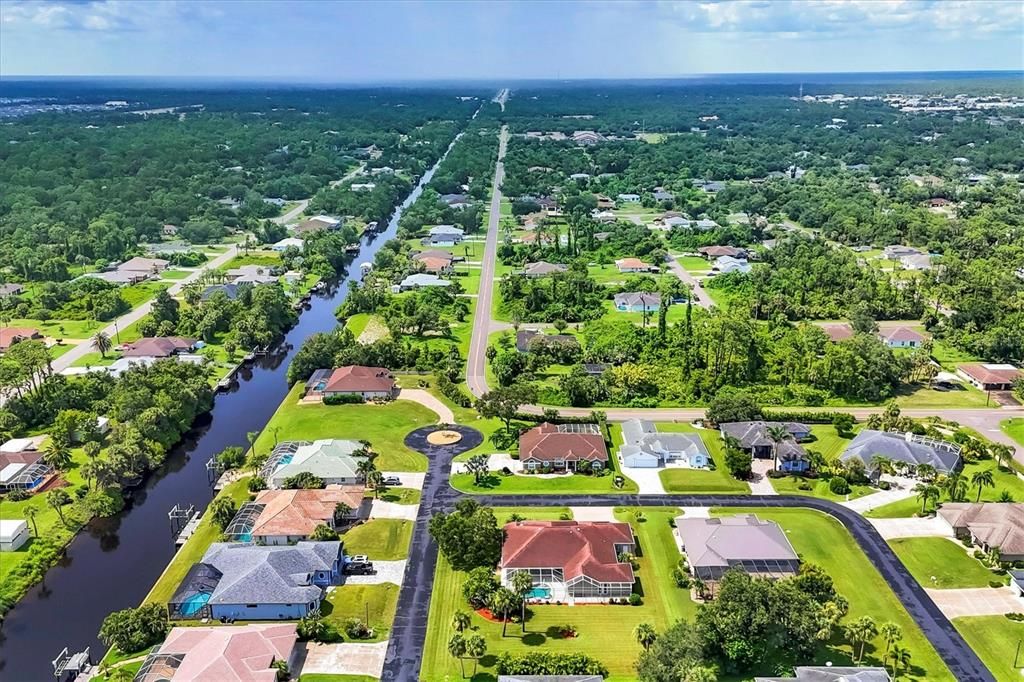 AERIAL OF COMMUNITY, CANAL AND BEYOND
