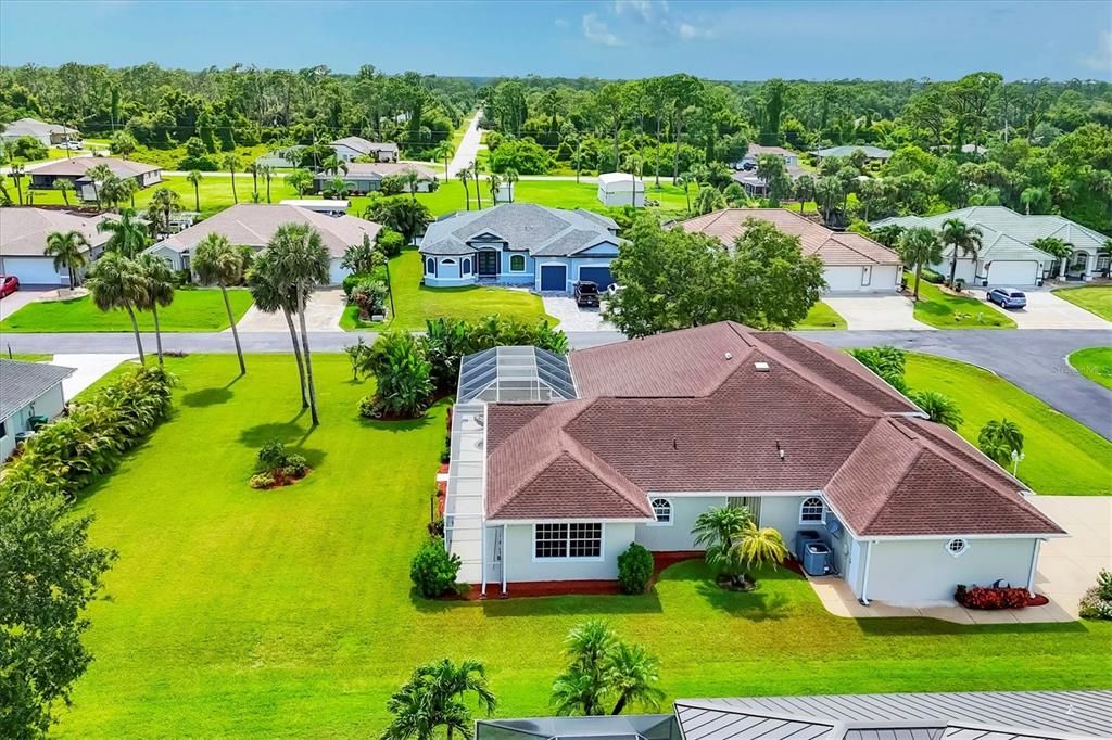 AERIAL VIEW FROMSIDE OF HOME SHOWING DOUBLE LOT FOR JUST OVER A 1/2 ACRE
