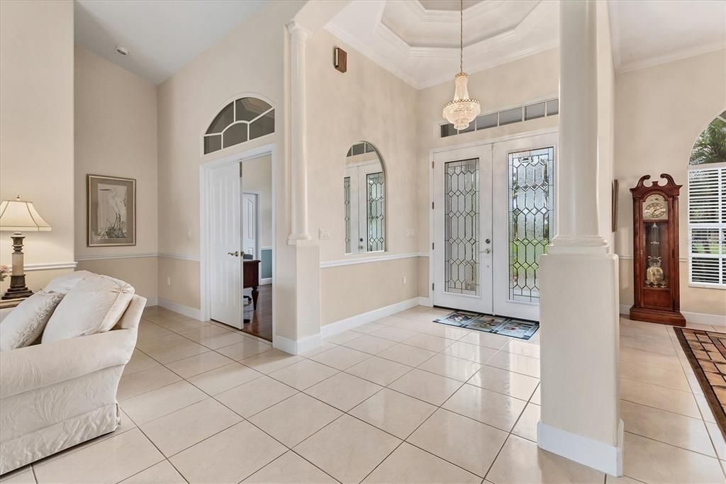BEAUTIFUL FOYER ENTRY DOUBLE LEADED GLASS FRONT DOORS AND DOUBLE TRAY CEILING ABOVE