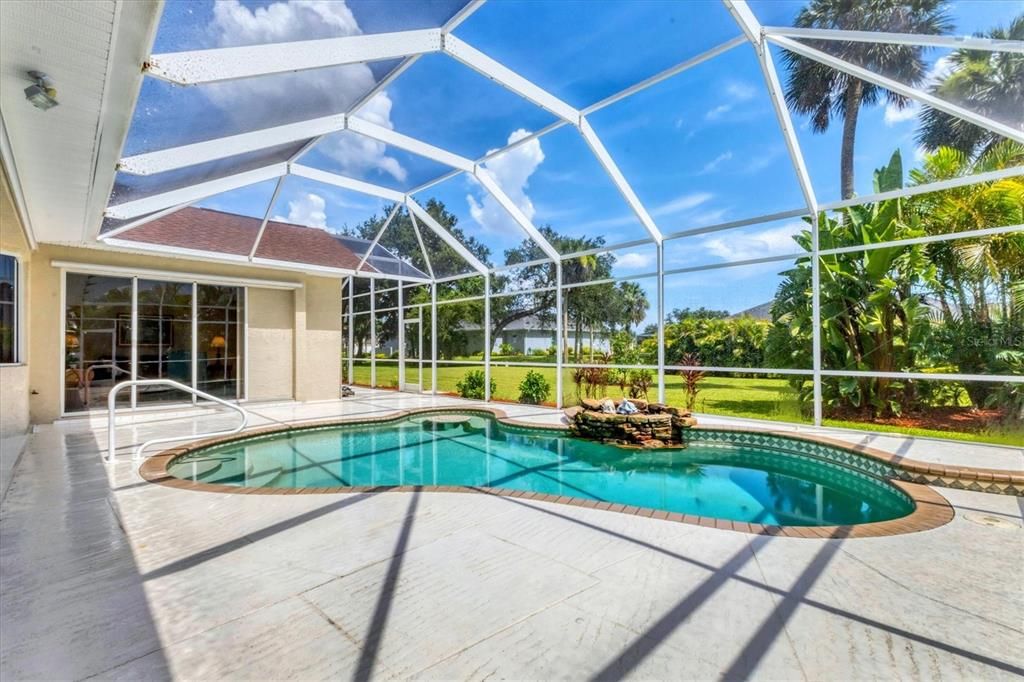 BEAUTY SURROUNDS YOU EVERYWHERE YOU LOOK HERE! LUSH MATURE LANDSCAPE ALL AROUND THE HOME