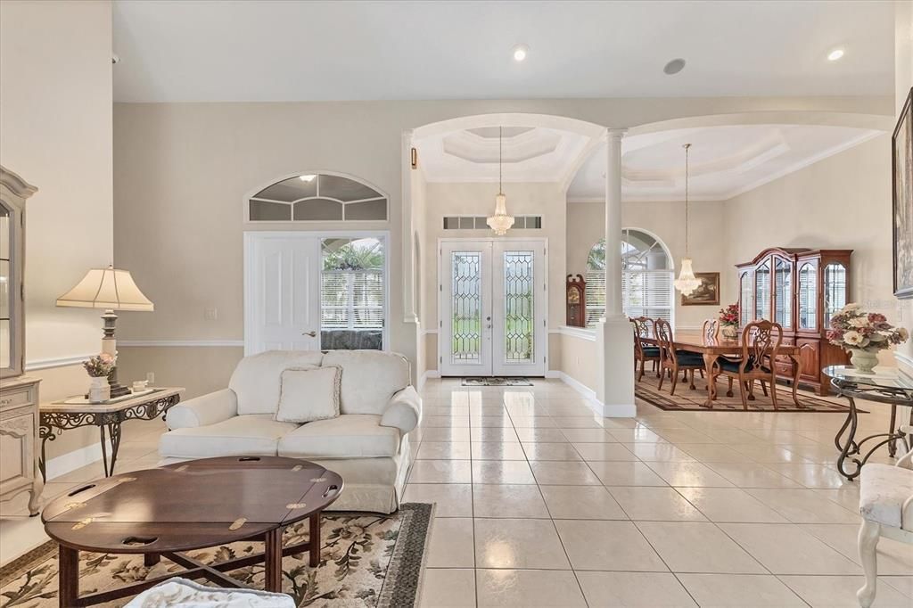 LIVING, ENTRY AND DINING (OPEN DOORWAY TO LEFT OF ENTRY IS 1 OF 3 GUEST BEDROOMS