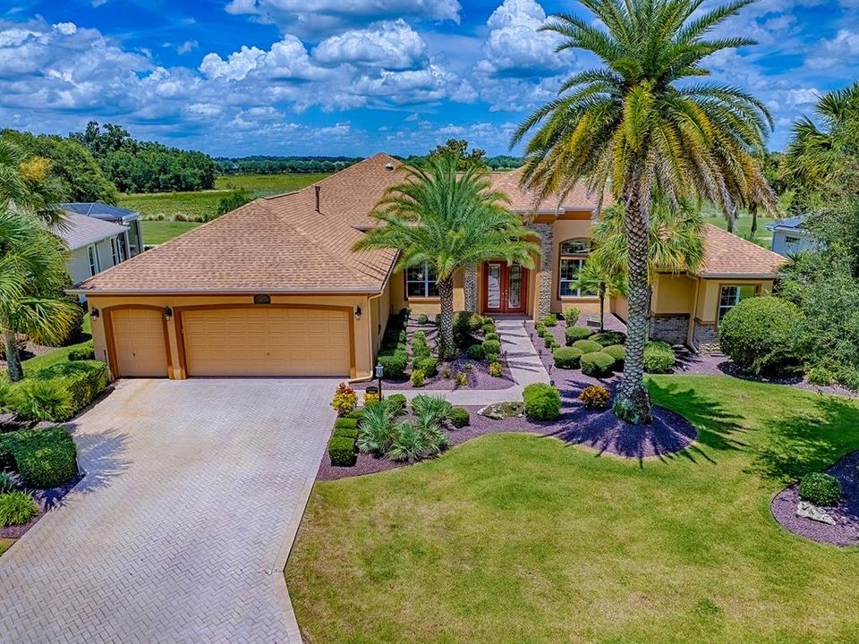 LOVELY CUSTOM ST. JOHNS PREMIER HOME ON THE 2ND HOLE OF THE RILEY GOLF COURSE LOCATED IN THE VILLAGE OF BRIDGEPORT AT LAKE SUMTER.