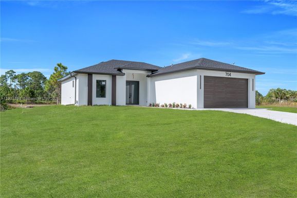 704 HOLMES AVE, Lehigh Acres FL 33974