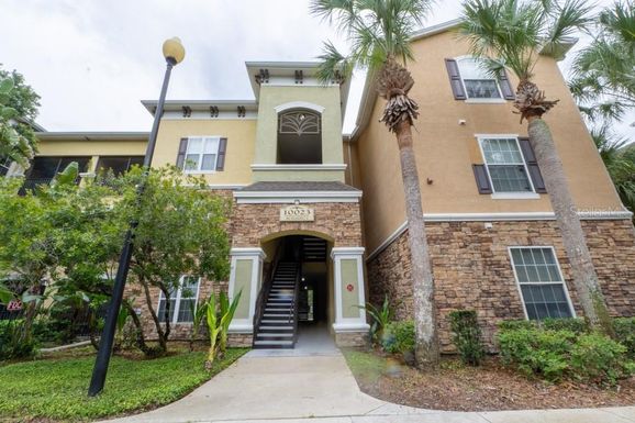 10023 COURTNEY PALMS BOULEVARD UNIT 104